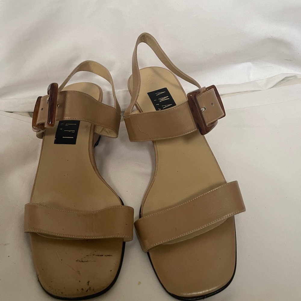 Never worn. Scuffs due to storage and moving.